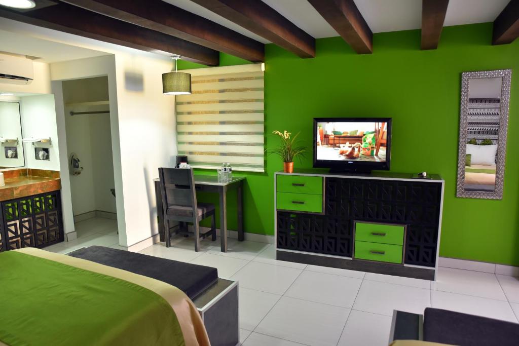 TV a/nebo společenská místnost v ubytování Baja Inn Hoteles Rio