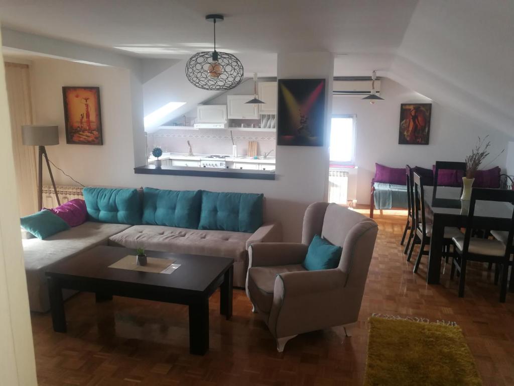 a living room with a couch and chairs and a table at Apartment Nedic in Doboj