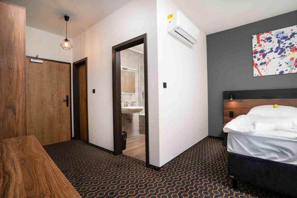 Postel nebo postele na pokoji v ubytování Hotel Mamut
