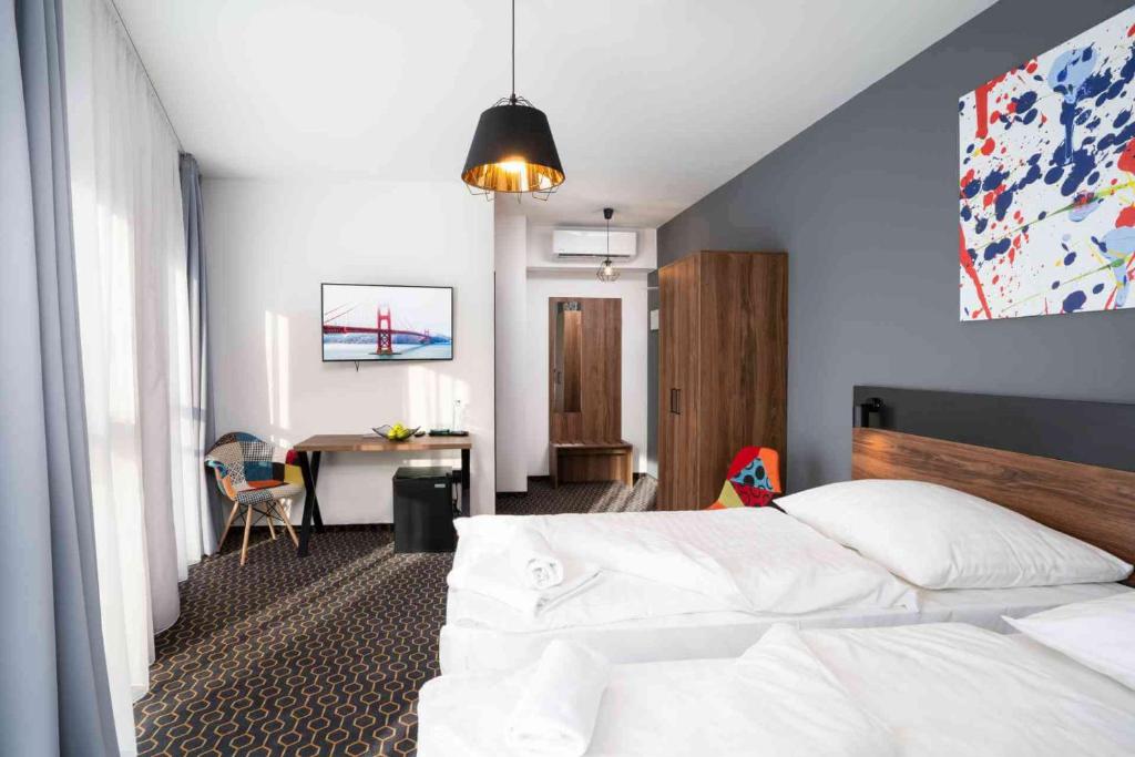 Postel nebo postele na pokoji v ubytování Hotel Mamut
