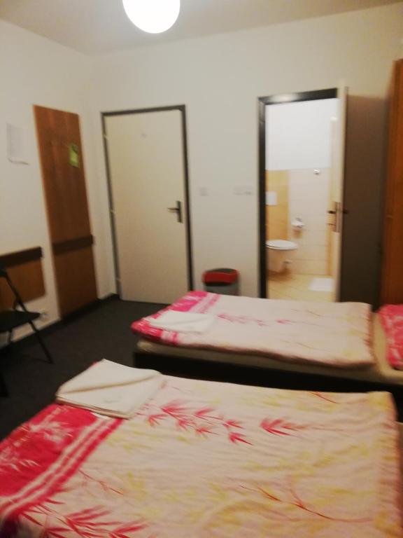 Postel nebo postele na pokoji v ubytování ABC Hotel Nitra
