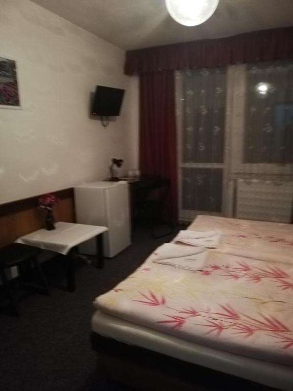 Postel nebo postele na pokoji v ubytování ABC Hotel Nitra