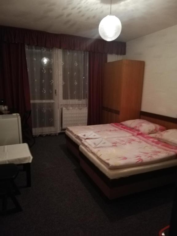 Postel nebo postele na pokoji v ubytování ABC Hotel Nitra