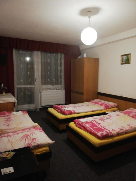 Postel nebo postele na pokoji v ubytování ABC Hotel Nitra