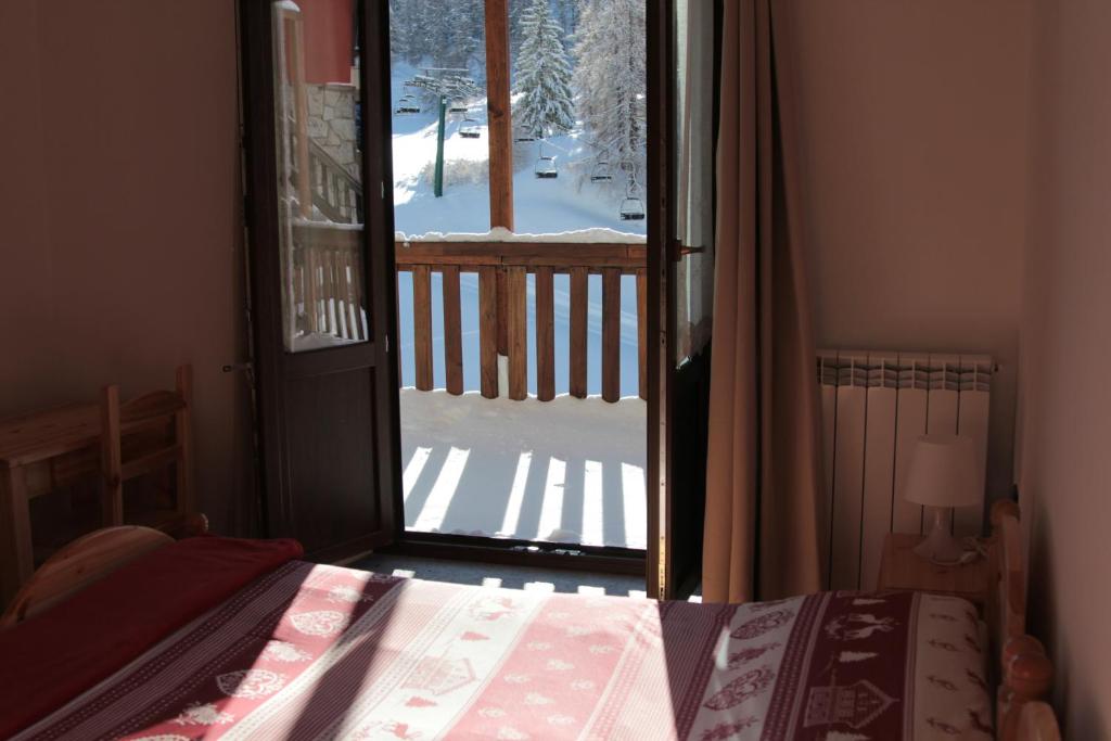 Postel nebo postele na pokoji v ubytování Hotel Al Foiron