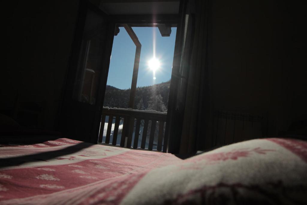 Postel nebo postele na pokoji v ubytování Hotel Al Foiron