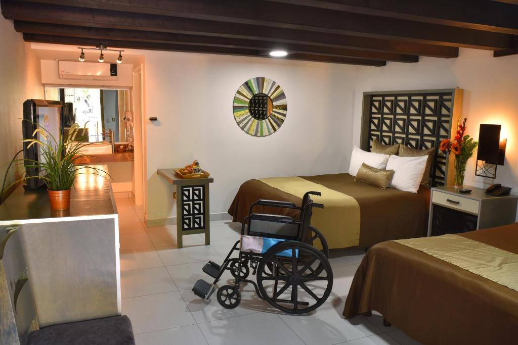 Postel nebo postele na pokoji v ubytování Baja Inn Hoteles Rio