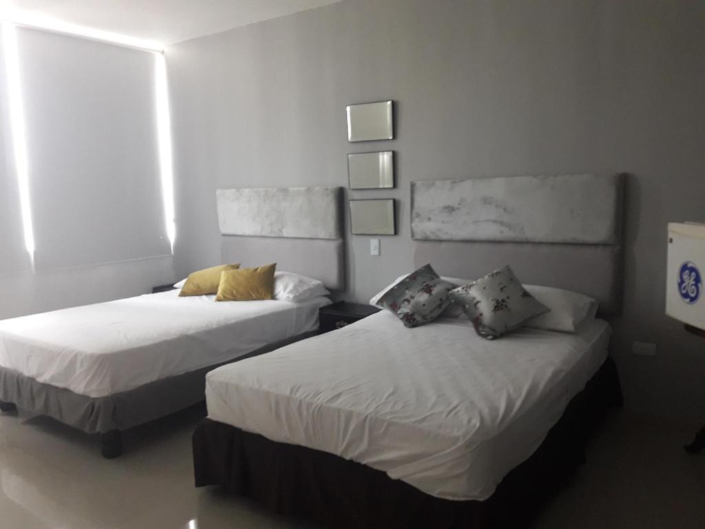 Postel nebo postele na pokoji v ubytování Hotel Boutique Casa Umiña