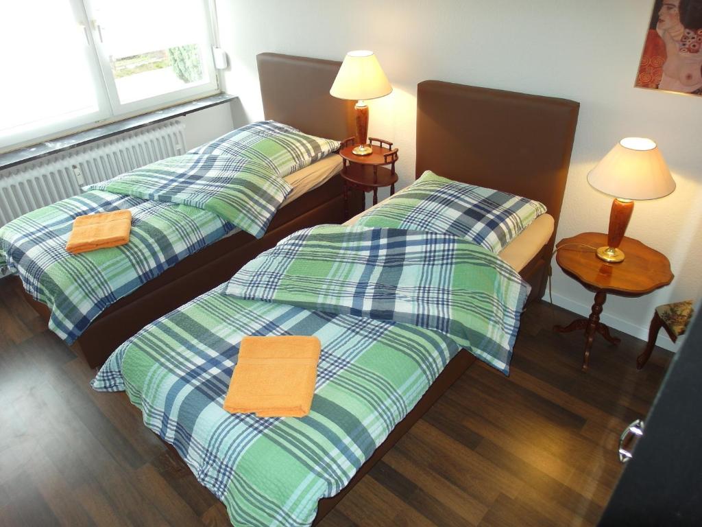 Postel nebo postele na pokoji v ubytování Wohnen mit Stil