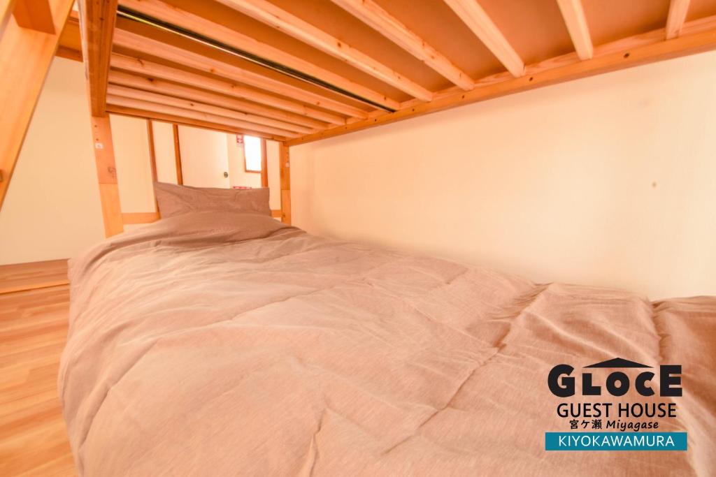 Postel nebo postele na pokoji v ubytování GLOCE 宮ヶ瀬 モビリティゲストハウス l Miyagase Mobility Guest House