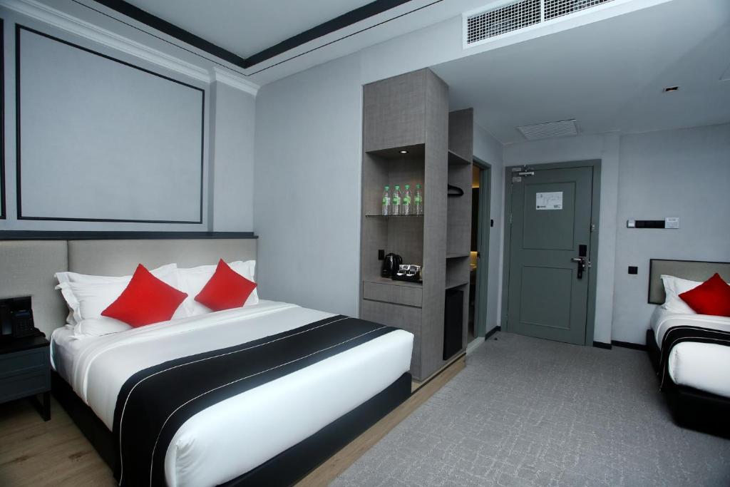 Postel nebo postele na pokoji v ubytování Stanton Hotel