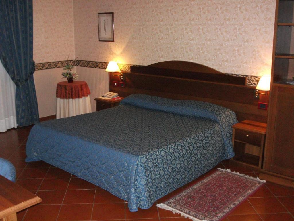 Postel nebo postele na pokoji v ubytování Ariotto Village