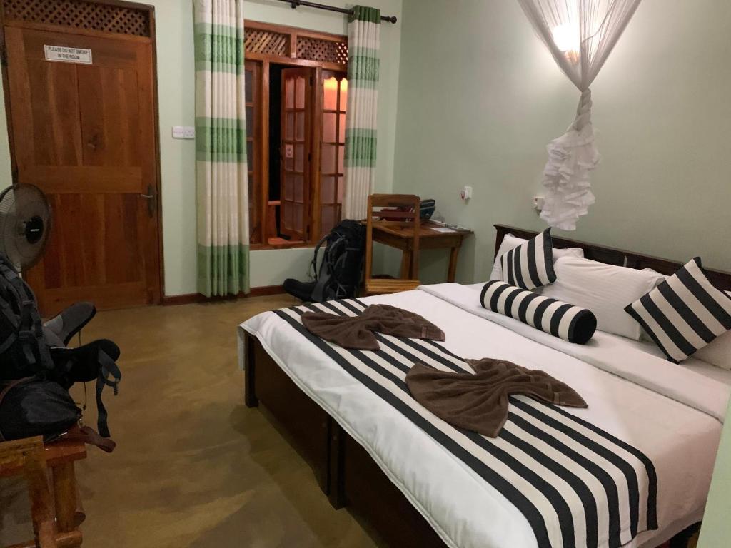 Postel nebo postele na pokoji v ubytování Dinaro Guest