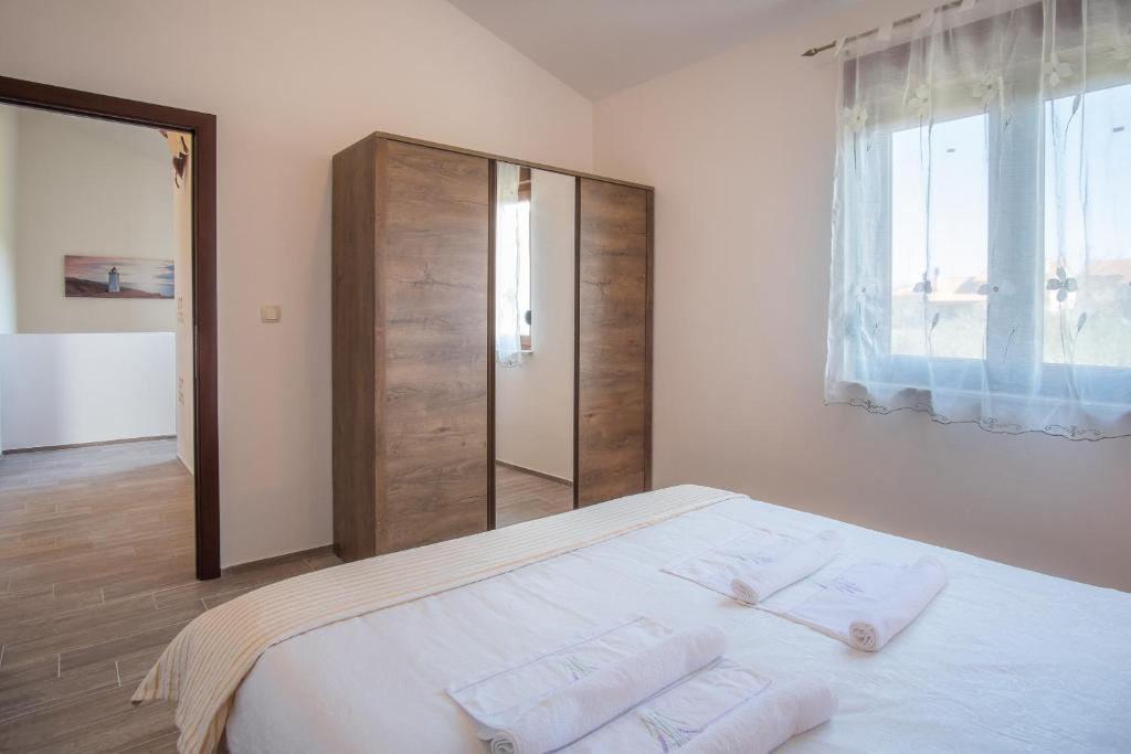 Łóżko lub łóżka w pokoju w obiekcie Villa Dijana East