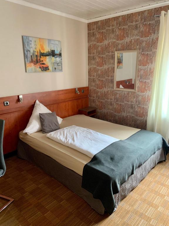 Postel nebo postele na pokoji v ubytování Gästehaus Präsenzhof