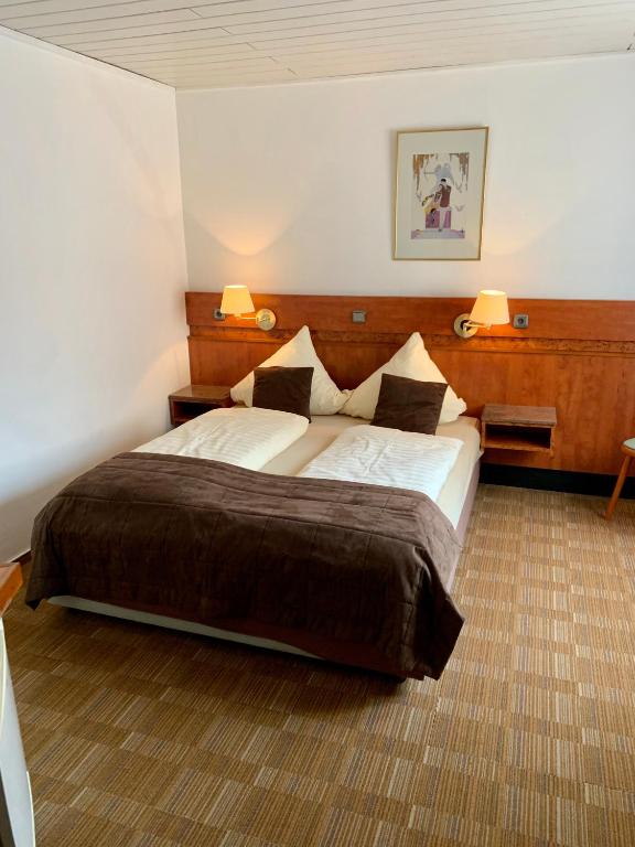 Postel nebo postele na pokoji v ubytování Gästehaus Präsenzhof
