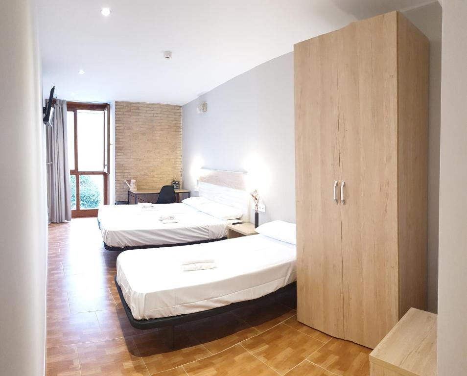 Postel nebo postele na pokoji v ubytování B&B La Atalaya