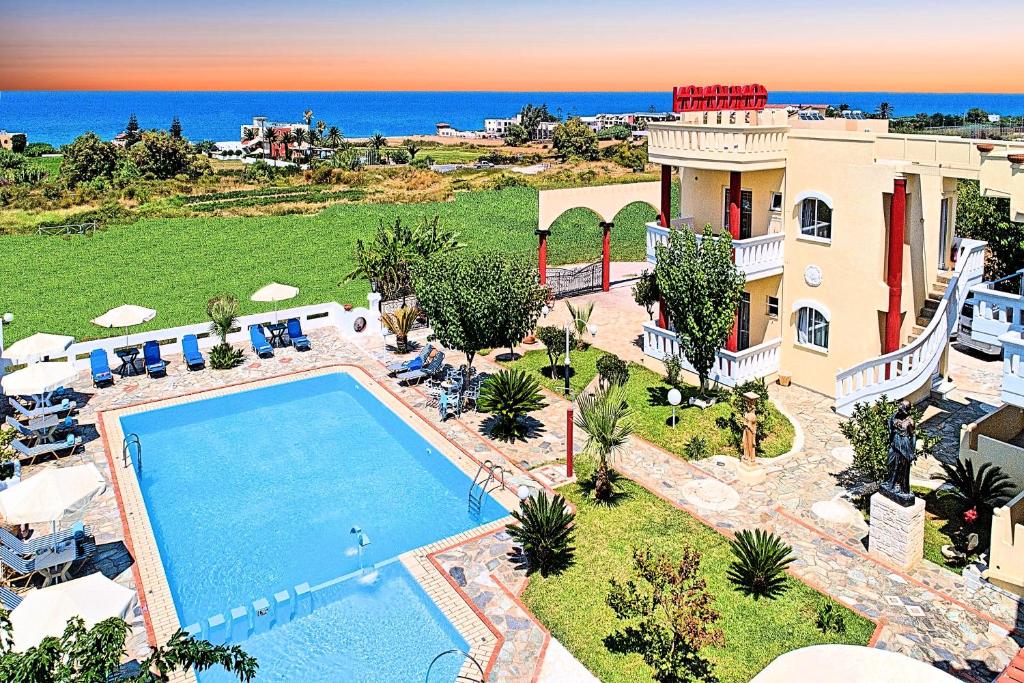 uma vista aérea de uma villa com piscina em Palladion Hotel em Georgioupolis