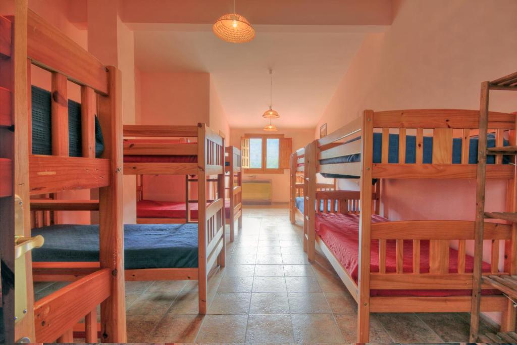 Postel nebo postele na pokoji v ubytování Albergue Barranc de la Serra