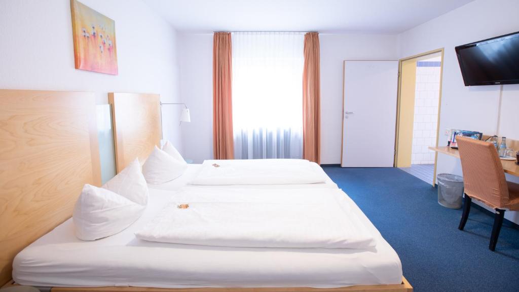 Postel nebo postele na pokoji v ubytování Hotel Elite