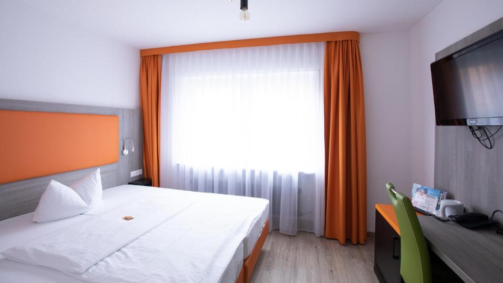 Postel nebo postele na pokoji v ubytování Hotel Elite