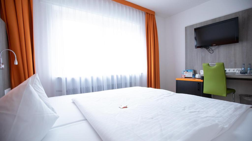 Postel nebo postele na pokoji v ubytování Hotel Elite