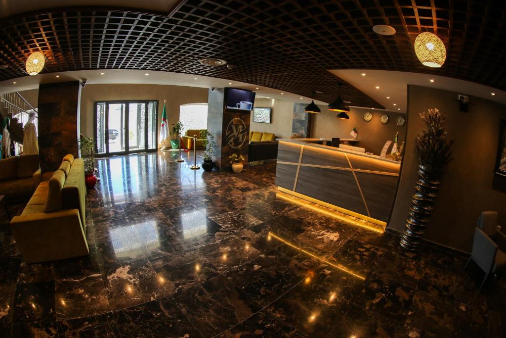 a room with a lobby with lights on the floor at Hotel Messaoudi in Batna