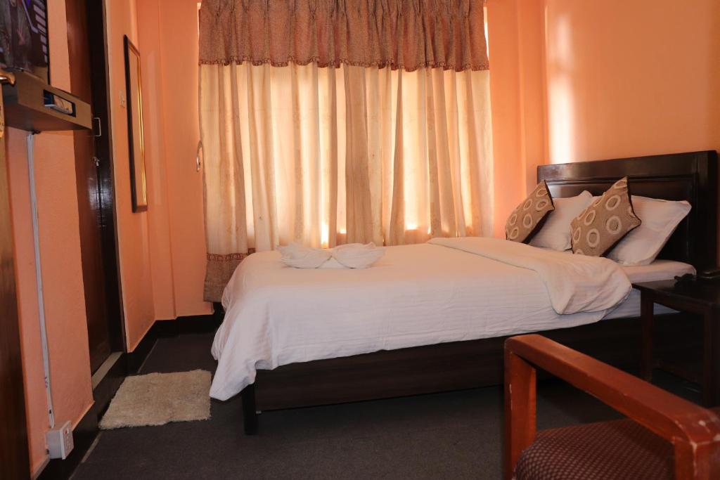 Postel nebo postele na pokoji v ubytování Hotel Hana Pvt.Ltd