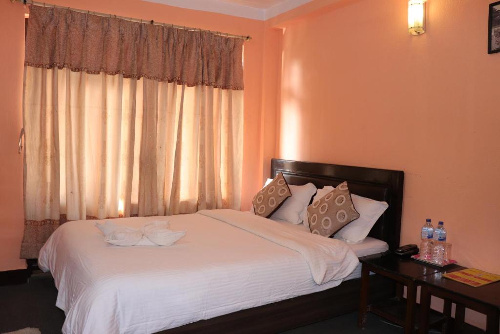 Postel nebo postele na pokoji v ubytování Hotel Hana Pvt.Ltd