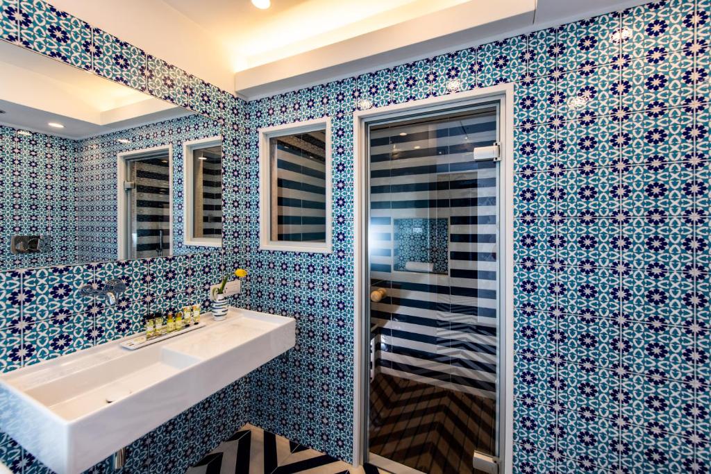 Koupelna v ubytování Imperati Suites by Alcione Residence