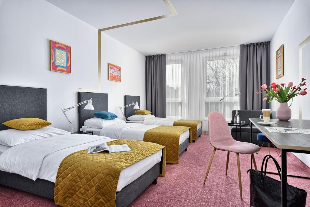 Posteľ alebo postele v izbe v ubytovaní Hotel Arche Geologiczna