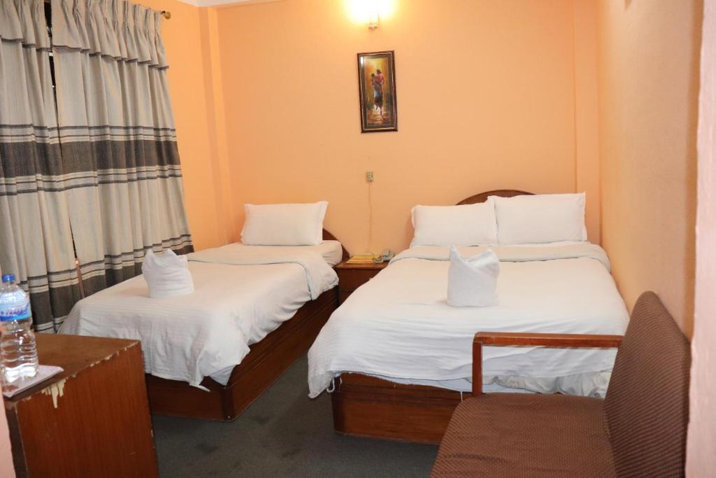 Postel nebo postele na pokoji v ubytování Hotel Hana Pvt.Ltd