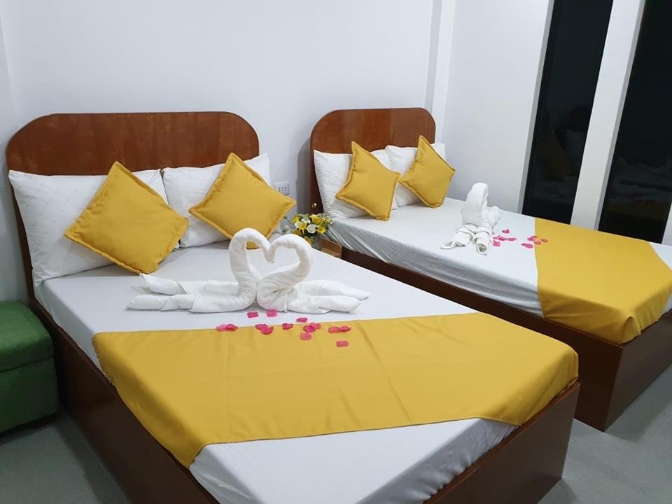 Postel nebo postele na pokoji v ubytování Camiguin KALIMBA DE LUNA INN