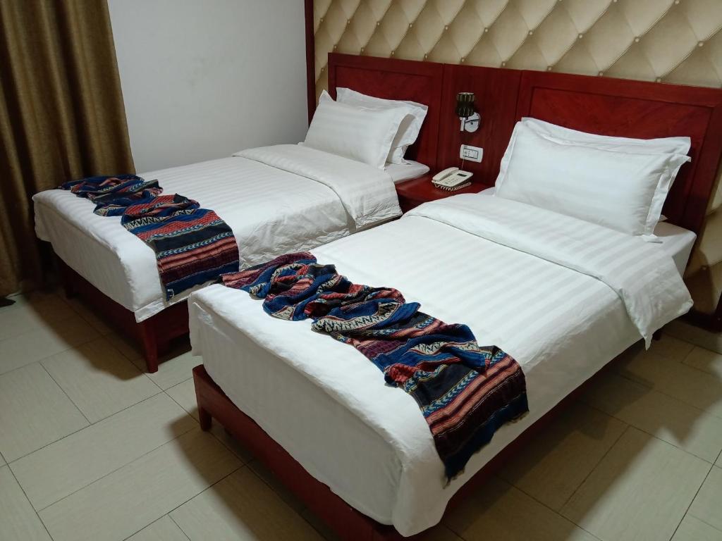 Voodi või voodid majutusasutuse seven7days hotel toas