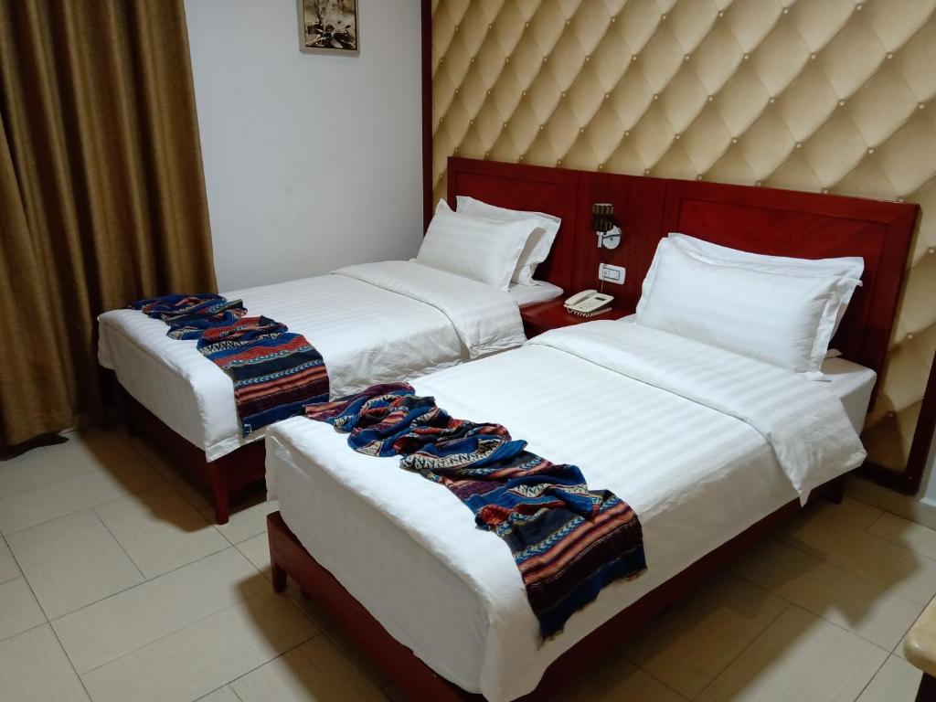Voodi või voodid majutusasutuse seven7days hotel toas