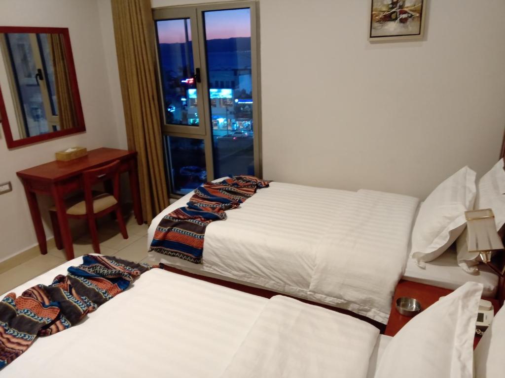 Voodi või voodid majutusasutuse seven7days hotel toas