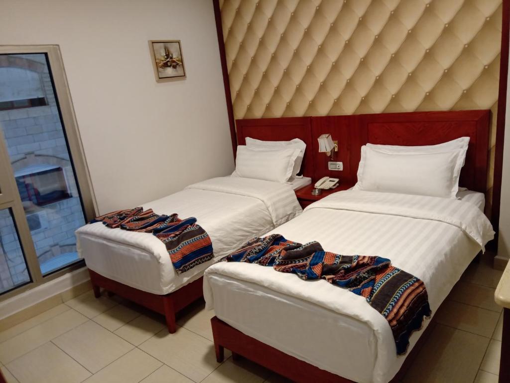 Voodi või voodid majutusasutuse seven7days hotel toas