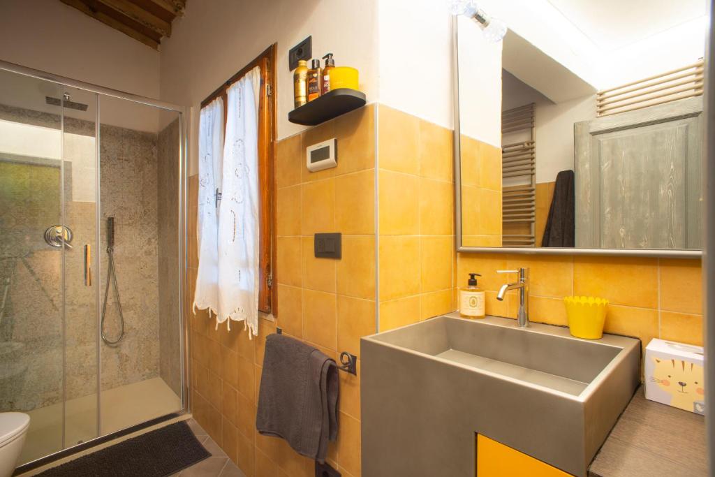 a bathroom with a sink and a shower at Silvia in S.Reparata in Florence