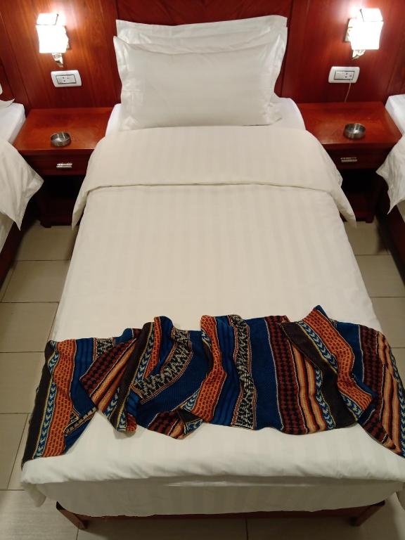 Voodi või voodid majutusasutuse seven7days hotel toas