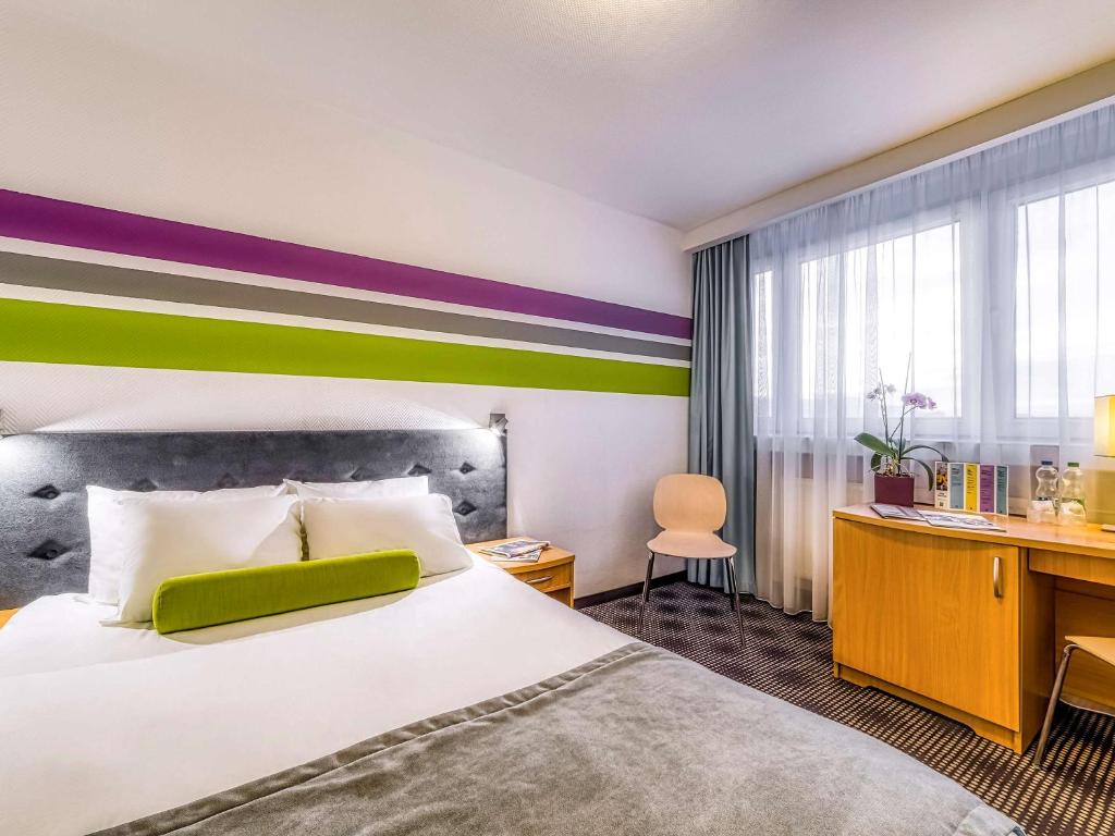 Ένα ή περισσότερα κρεβάτια σε δωμάτιο στο ibis Styles Bielsko Biala
