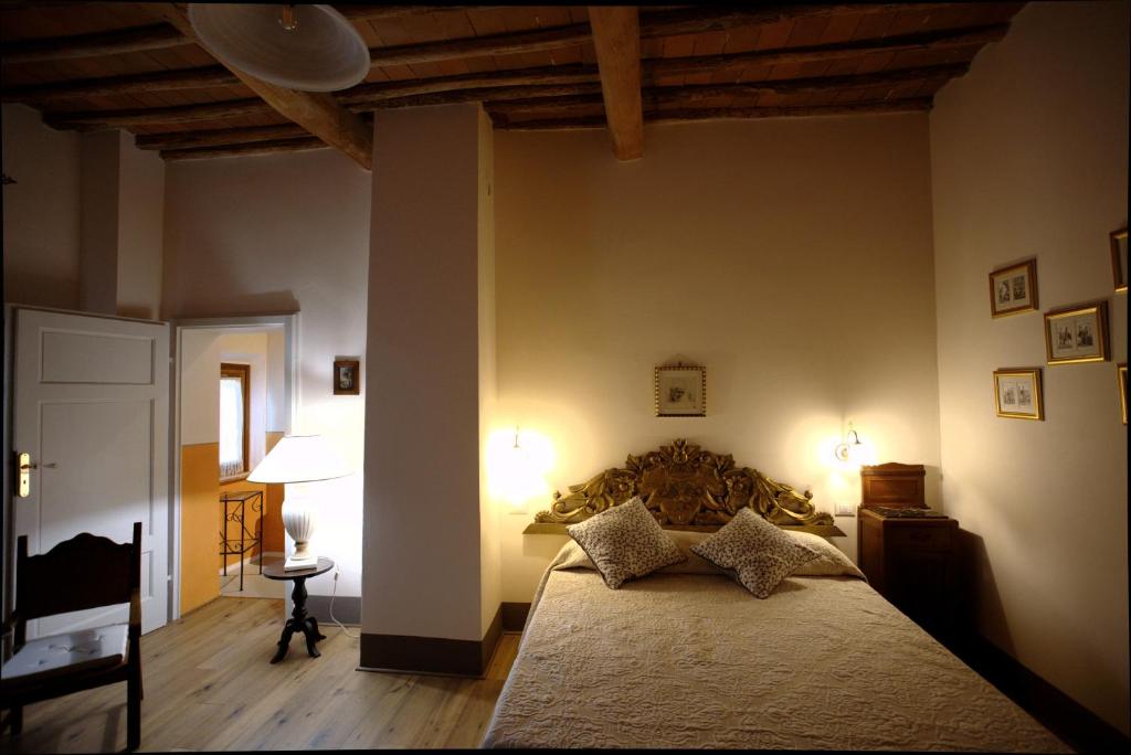 A bed or beds in a room at I Tre Poderi 1872