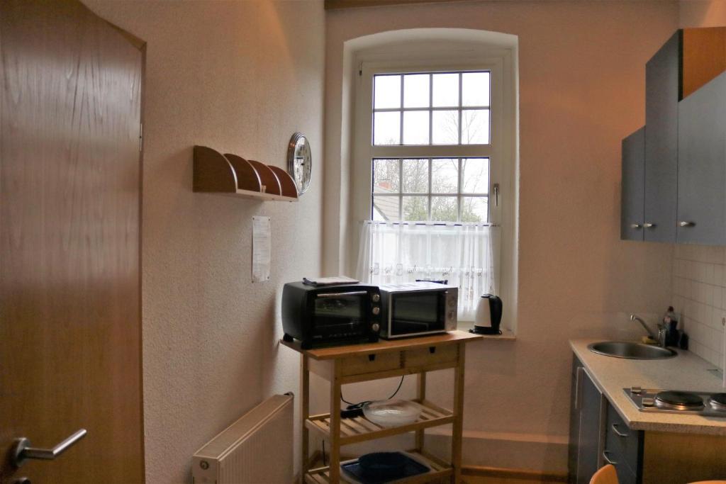Kuchyň nebo kuchyňský kout v ubytování Hotel Schmerkötter