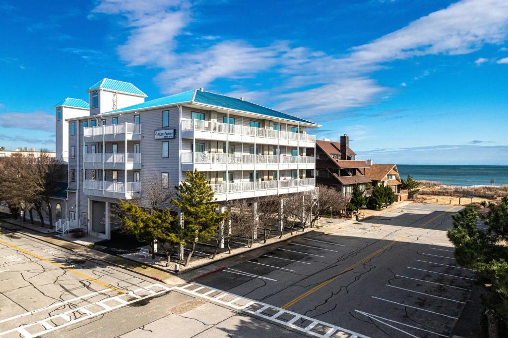 an apartment building on a street next to the ocean at Marylander Condominiums, 90 steps from the beach in Ocean City