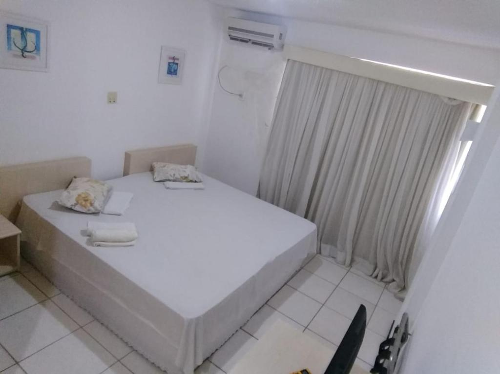Postel nebo postele na pokoji v ubytování Silva Hospedagem FLAT BELLAGIO BEIRA MAR