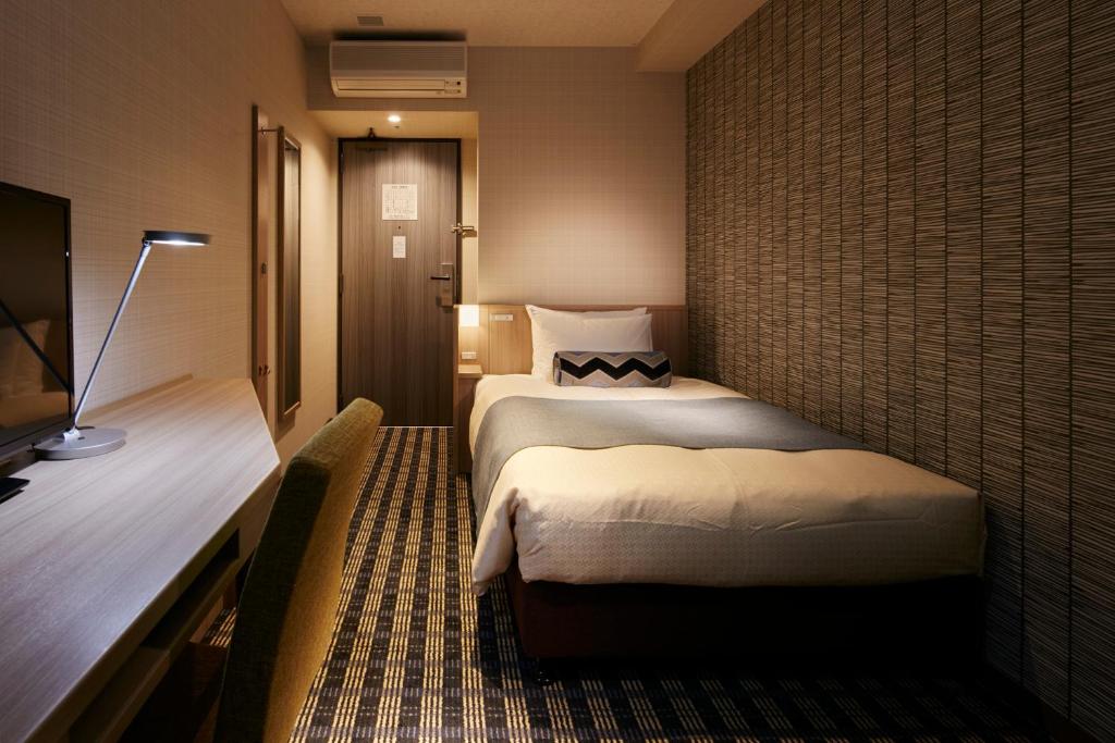 Postel nebo postele na pokoji v ubytování Garden Hotel Shizuoka