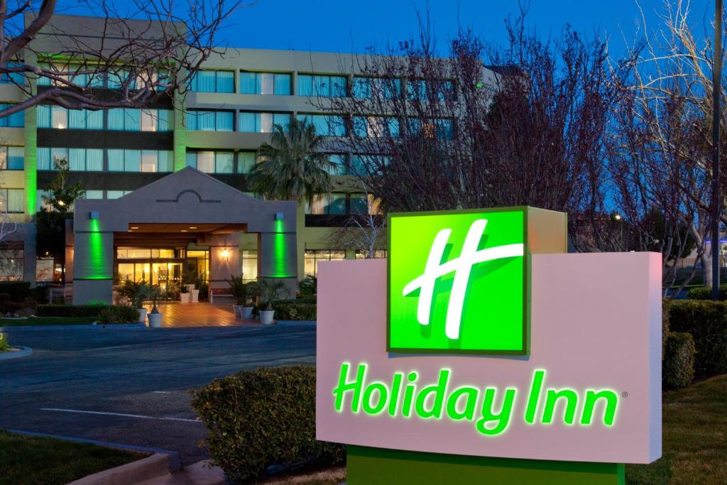 a sign in front of a holiday inn hotel at Holiday Inn Palmdale-Lancaster, an IHG Hotel in Palmdale