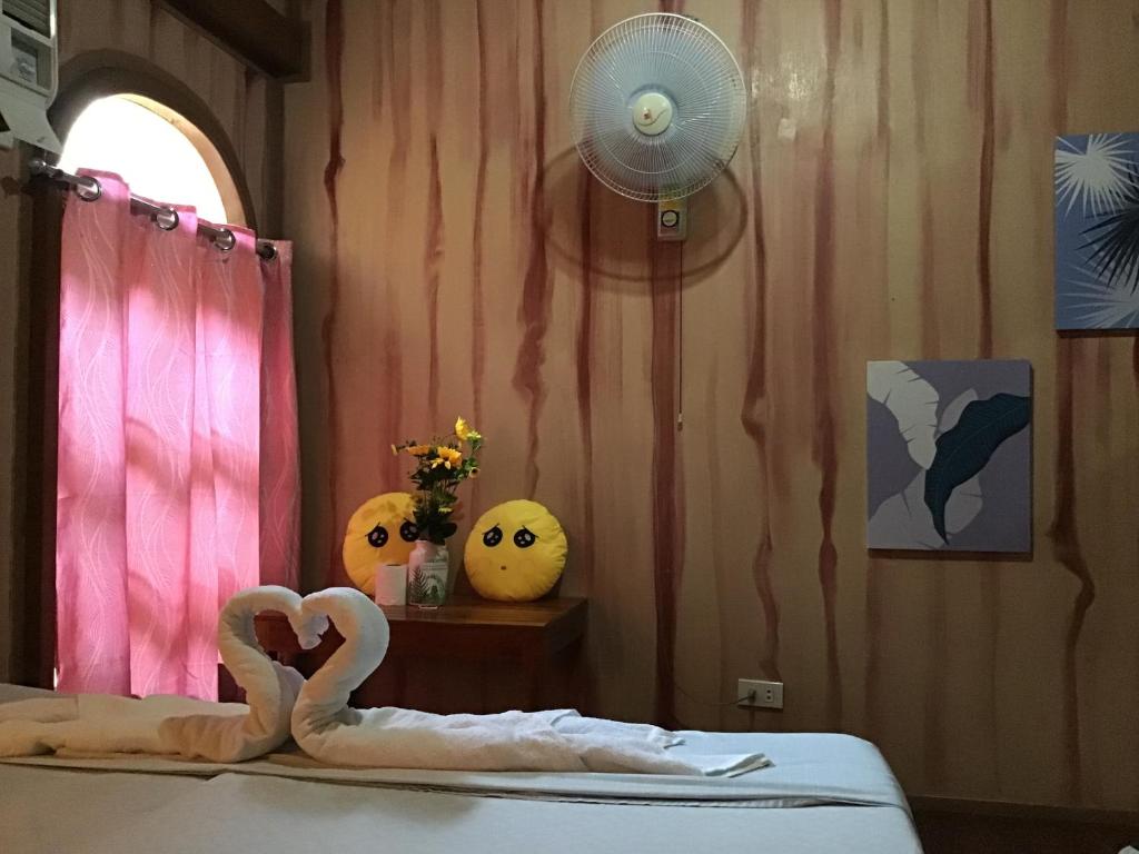 Postel nebo postele na pokoji v ubytování Ferranco Tourist Inn