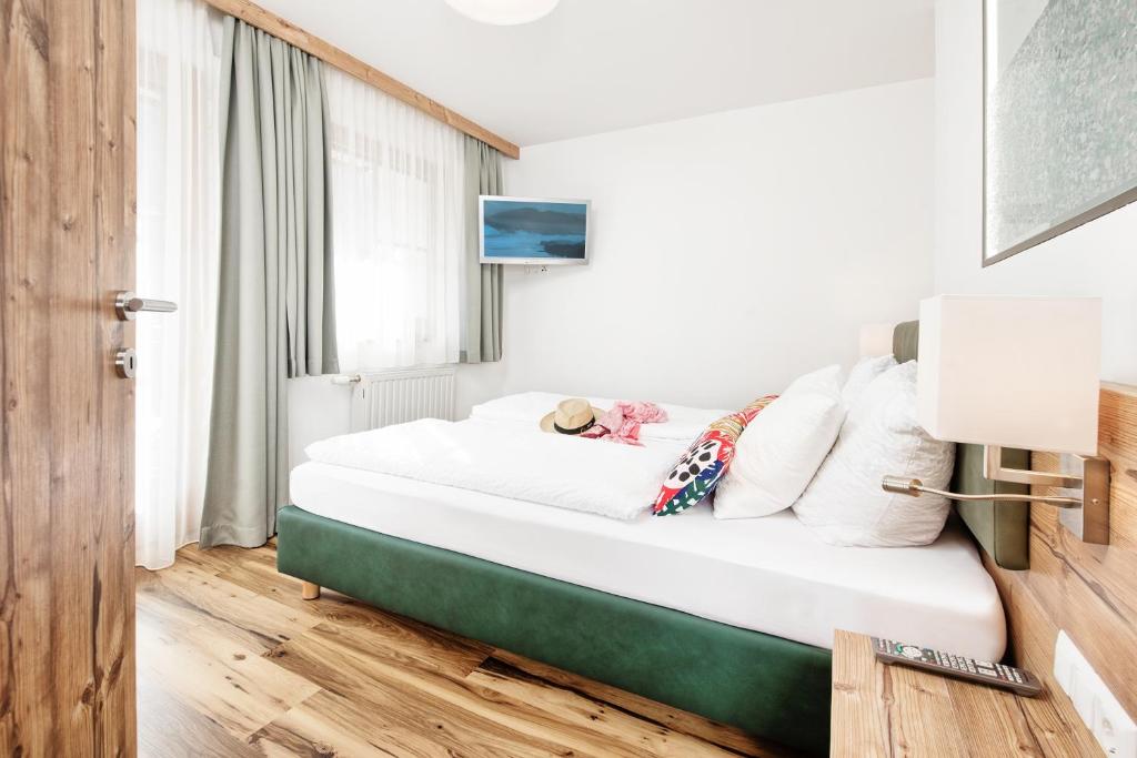 Postel nebo postele na pokoji v ubytování Wellness Landhaus Parth
