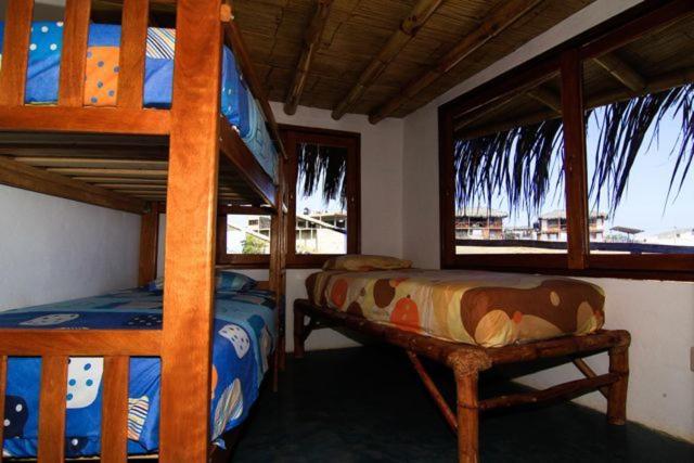 Postel nebo postele na pokoji v ubytování Oceanic Bungalows