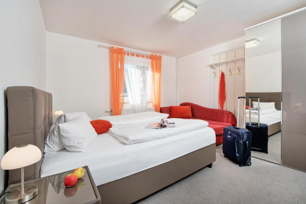 Postel nebo postele na pokoji v ubytování Wellness Landhaus Parth